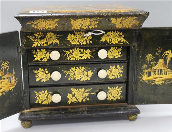 A Regency Japanned sewing box and contents